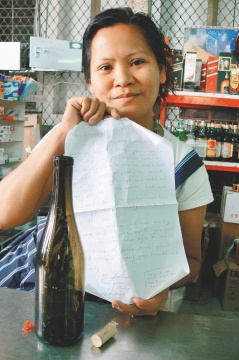 Xiao Wei with a message in a bottle